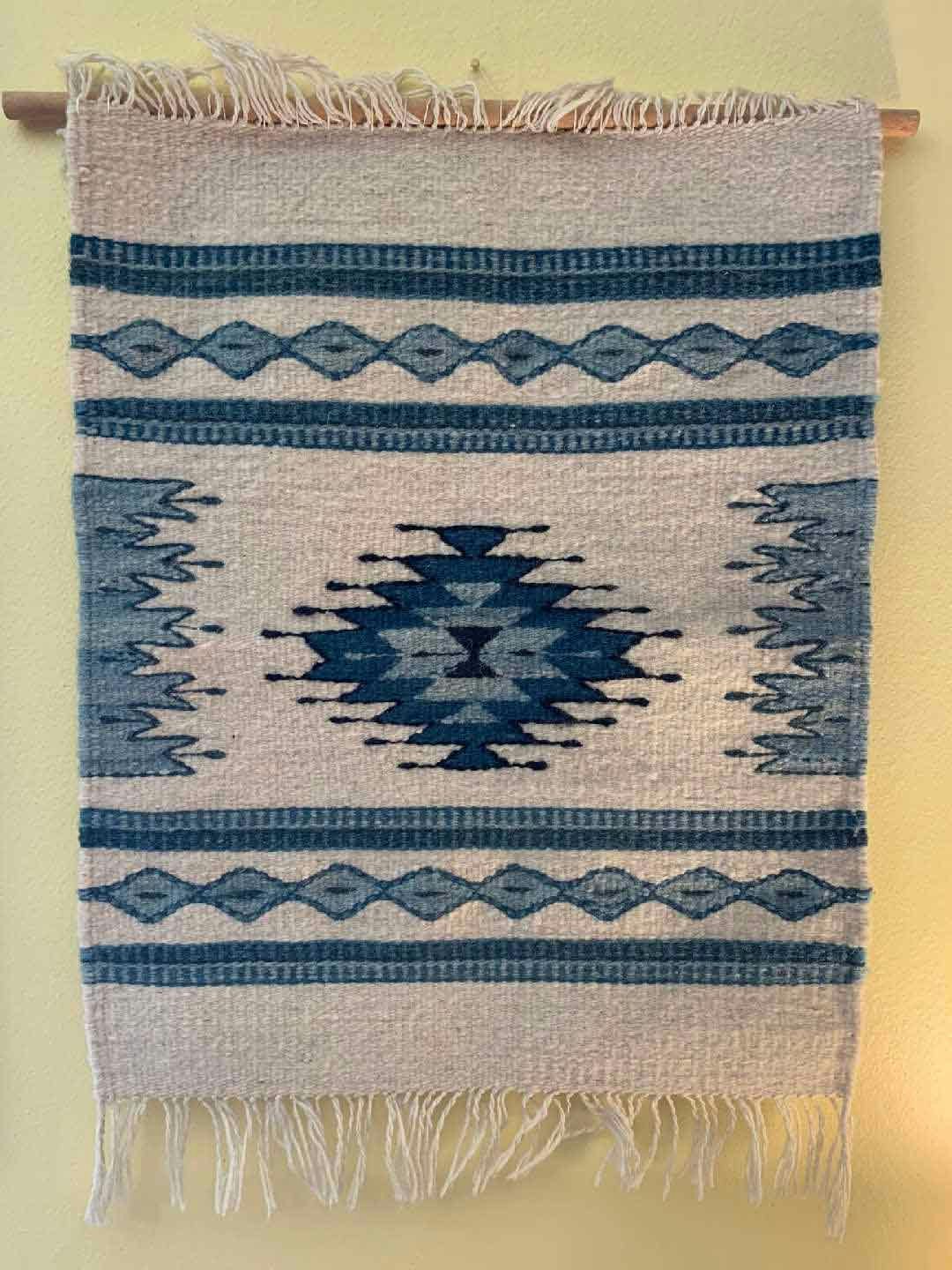 Small tapestry with dowel rod
