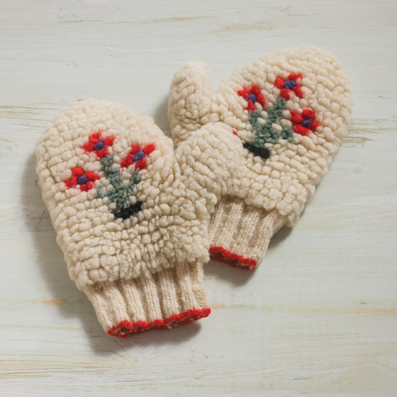 Donna Druchunas knitted loops with a second strand of yarn carried along as the knitting was worked, then cut, brushed, and trimmed them to create the finished texture in her warm and fuzzy Vermont Carriage Mittens. Photo by Joe Coca