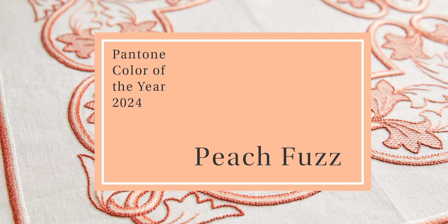 Pantone’s Color of the year for 2024, Peach Fuzz with a peach and white stitched tablecloth