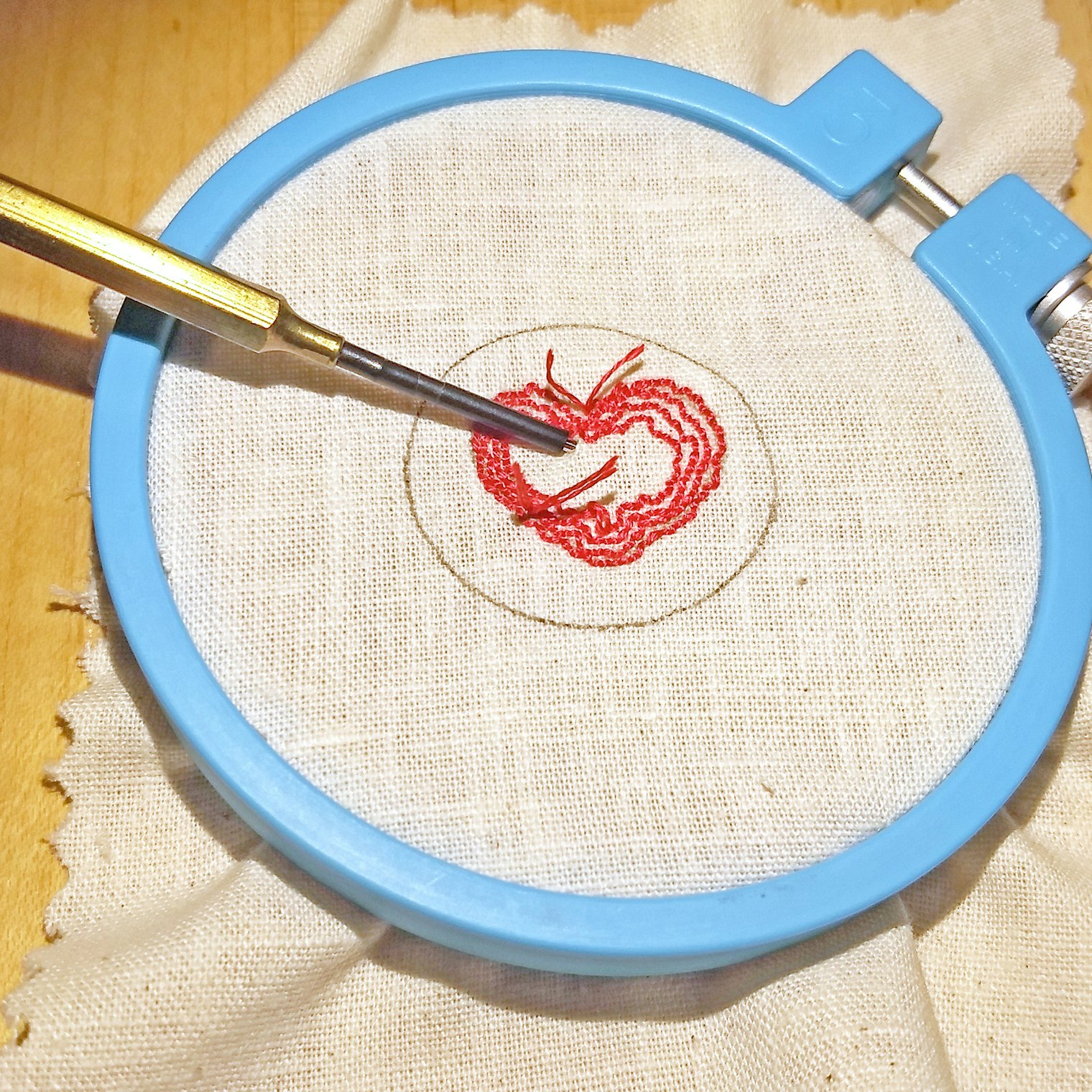 Four rows of stitches punched, moving from outline into center
