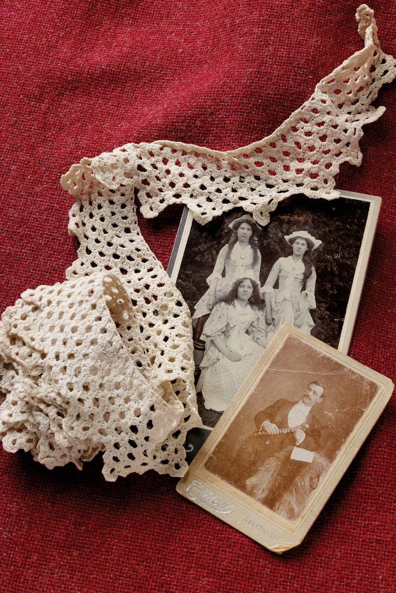 Crocheted lace and two black-and-white photos