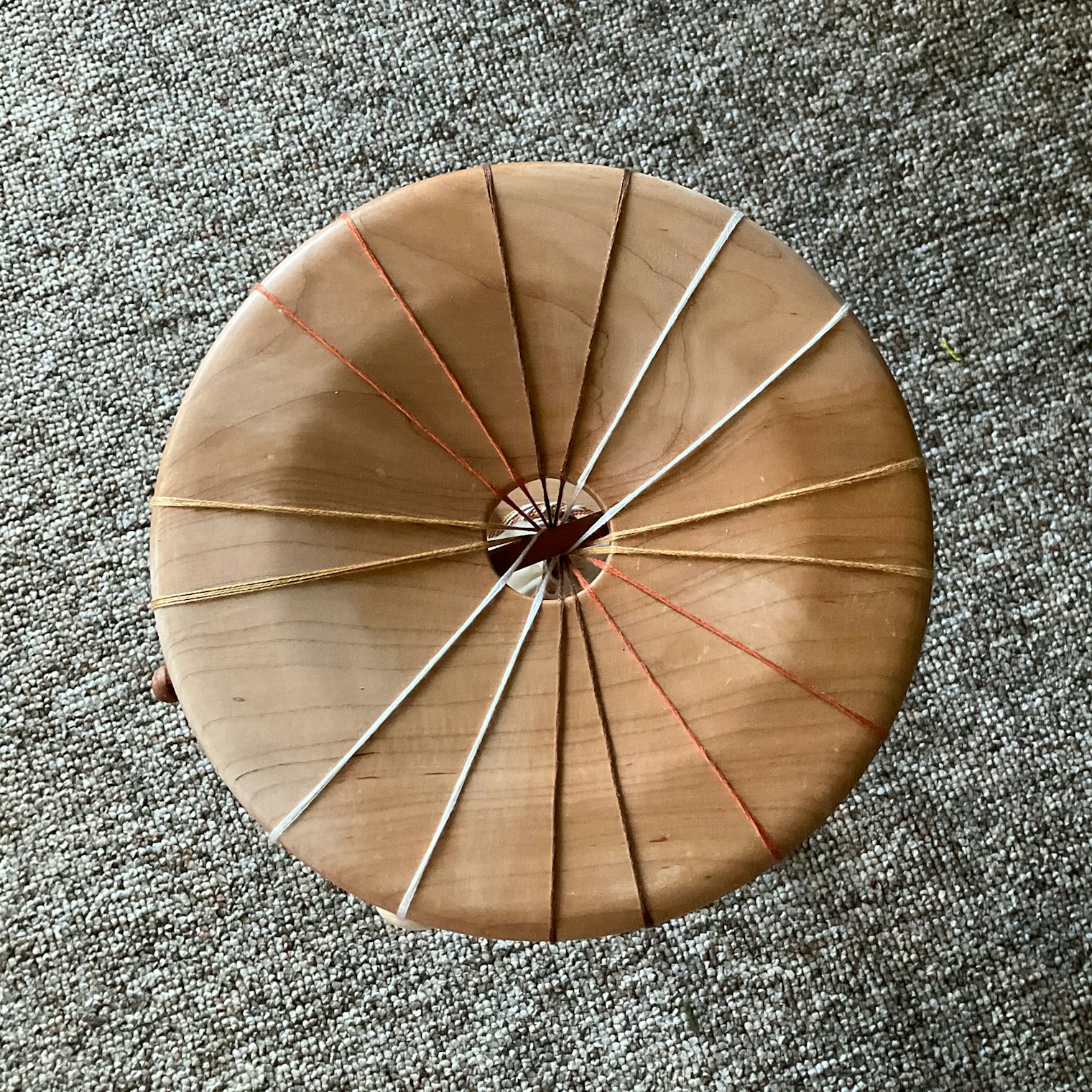 The mirror of the marudai, or top, is where the threads braid together.