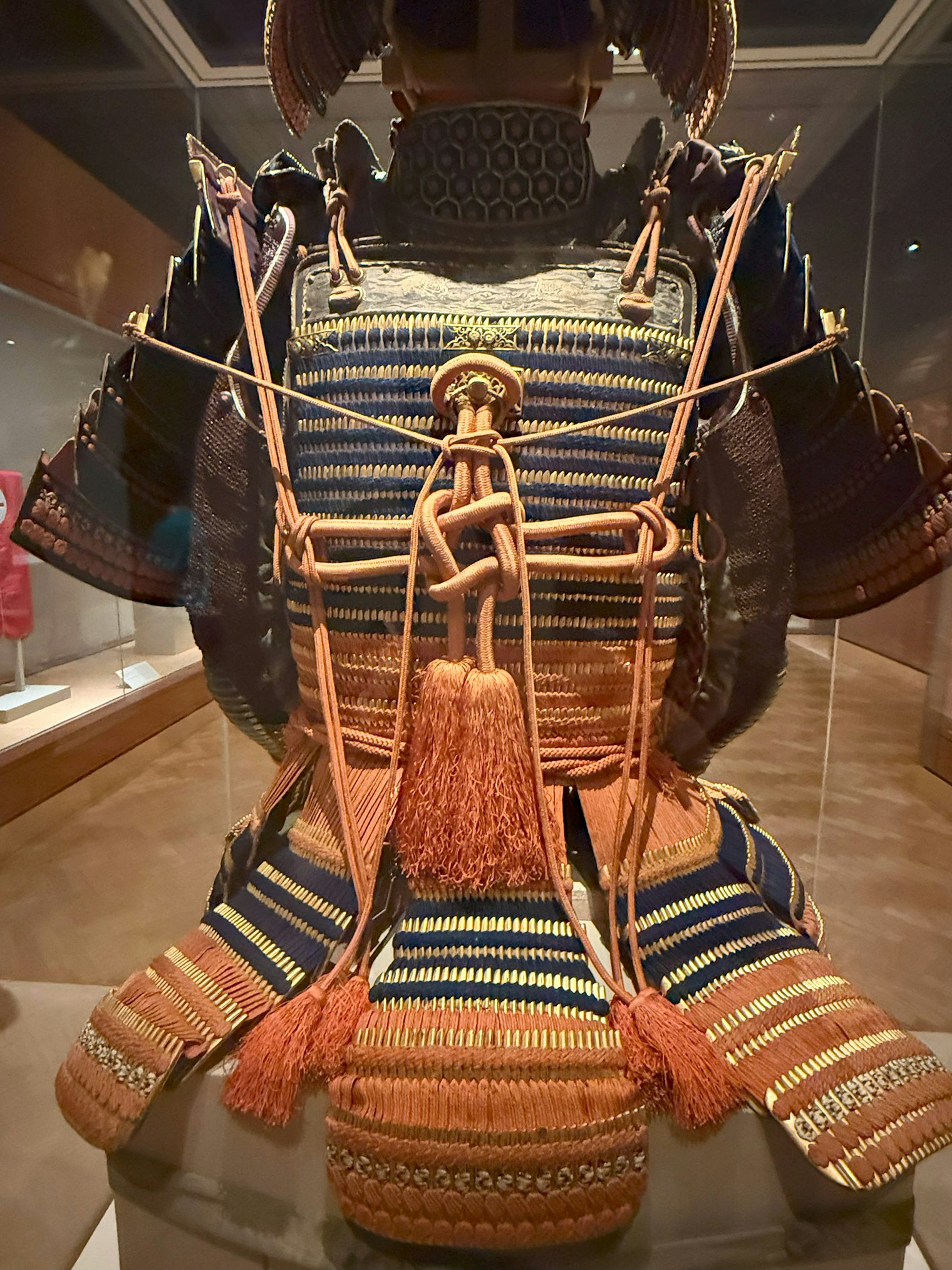 Back of the suit of armor showing elaborate knotting of cord. The Kii branch of the Tokugawa family ruled Japan for about 250 years. 