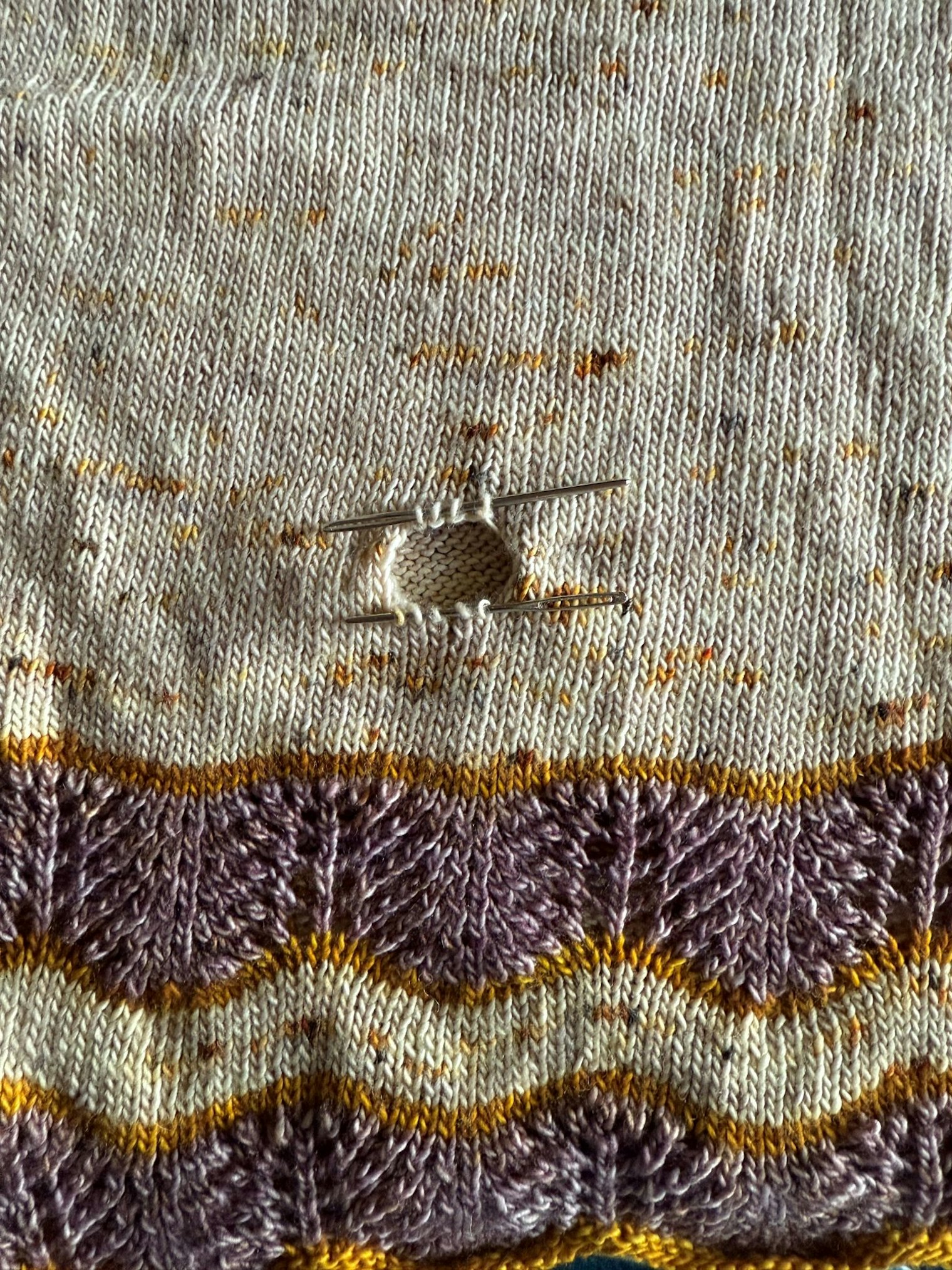 One of Nicole’s moth-damaged sweaters before mending.