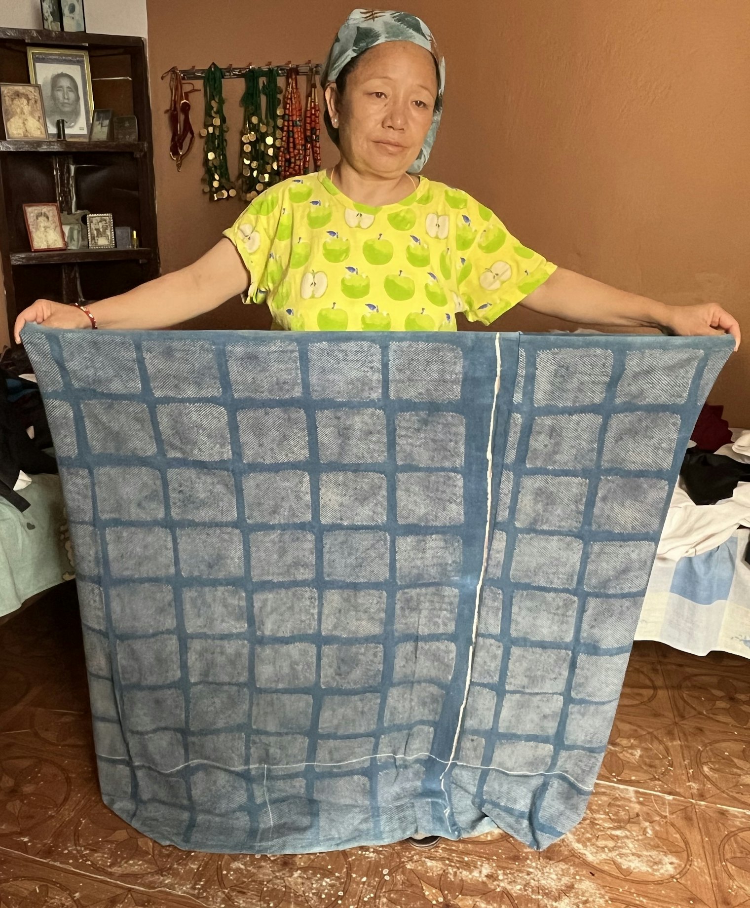 Lanka Gurung holds her chitko gunyo to show its size.