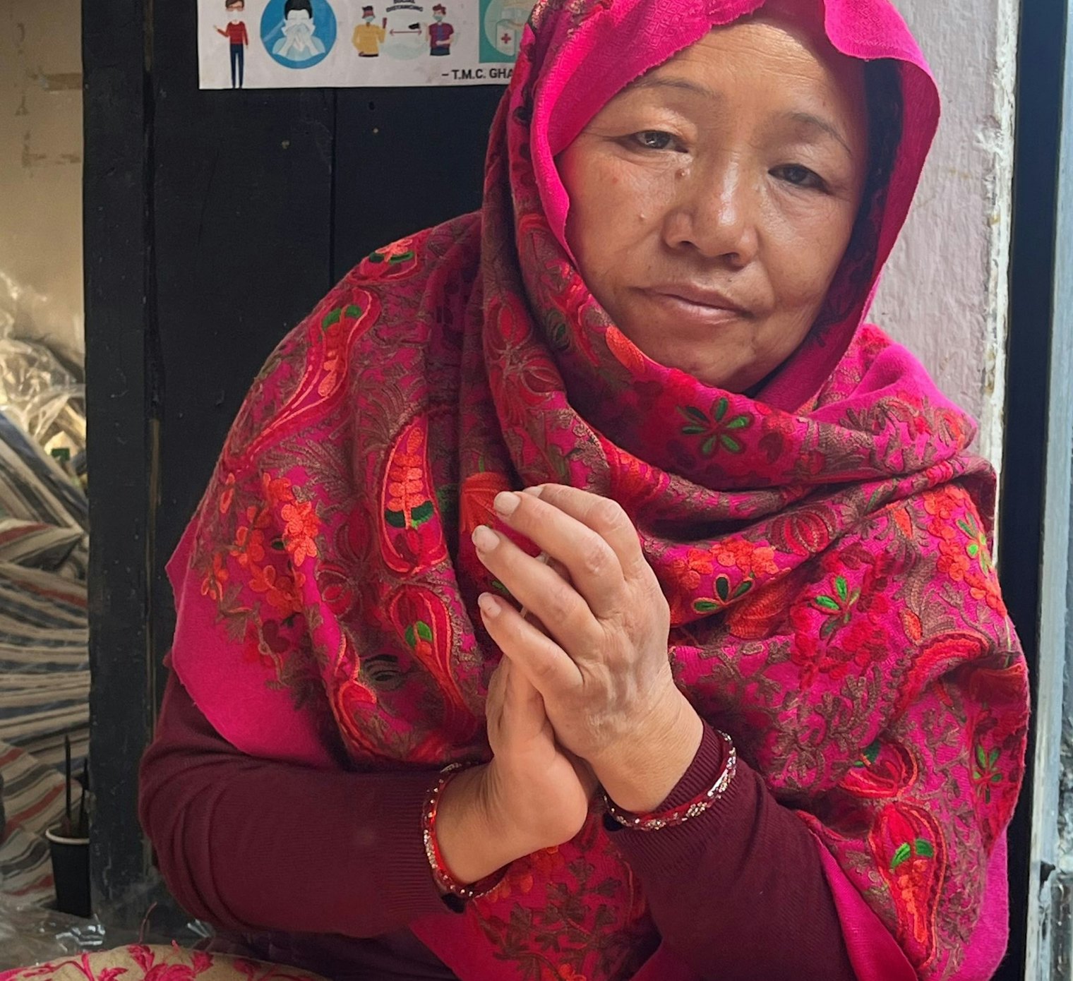 Lanka, wrapped in an Aari-style pachauri, celebrates at a wedding in Ghandruk.