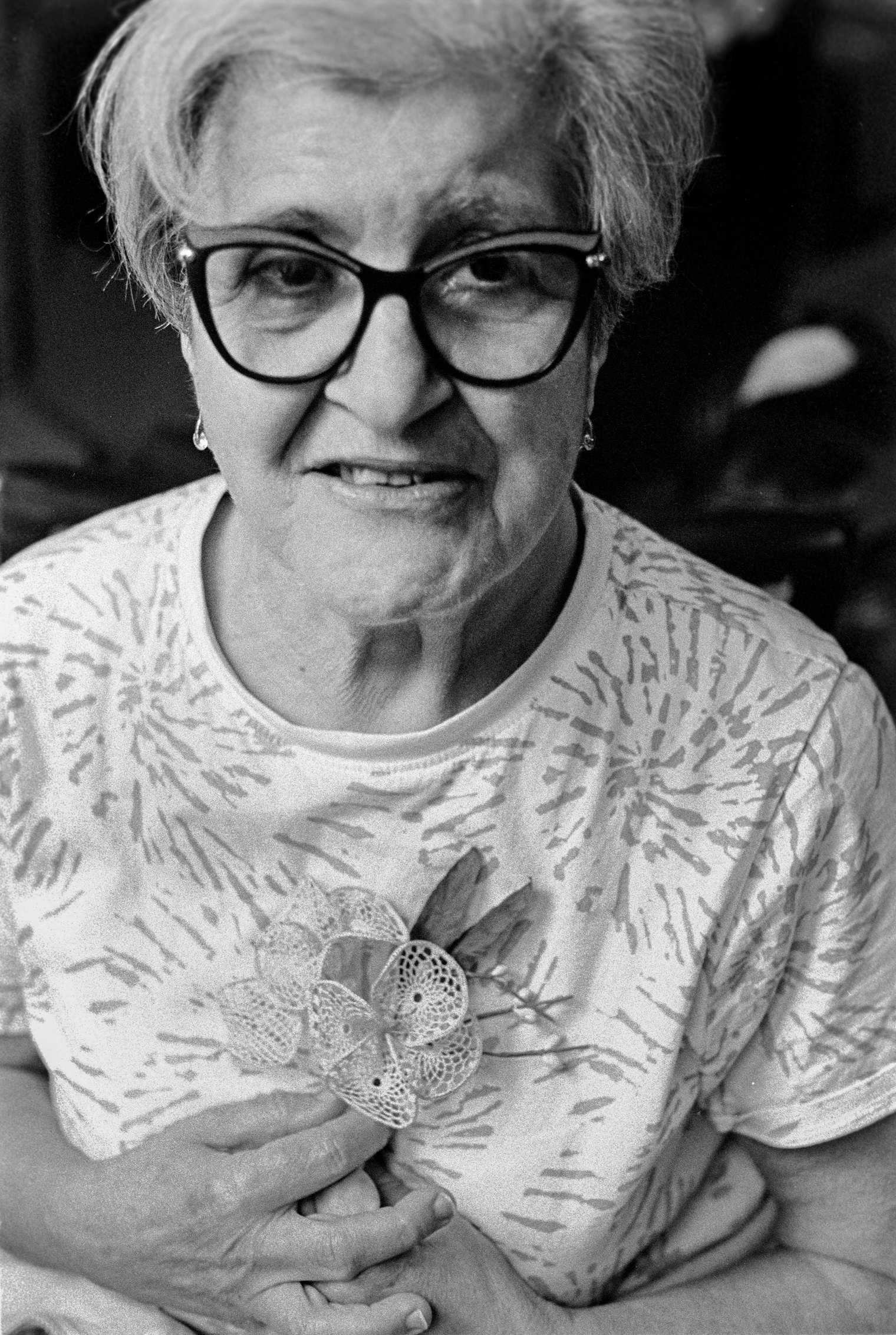 Portrait of Loretta Lovisa holding a wedding favor that her mother had made for Loretta’s wedding party. It is common in Orvieto to gift the mothers and bridesmaids Merletto di Orvieto corsages and bracelets to wear during the wedding ceremony. Loretta learned the art from her family members after being given a hook around age five. After working as an accountant and raising her children, Loretta opened a private lacemaking studio in Orvieto, where she also teaches Merletto di Orvieto lacemaking workshops.