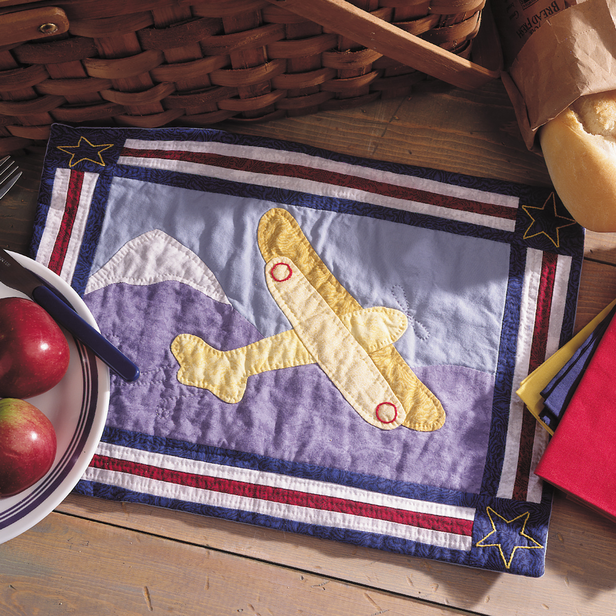 An Airplane Motif on a Quilted Placemat Image