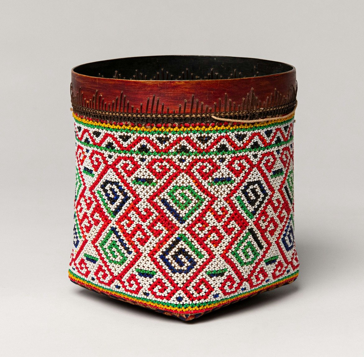 Unidentified Maker, Rice Seed Basket, 20th Century, Malaysia. Glass beads, wood, and cotton thread. 7 x 6 x 6 inches. Gift of Mark A. Johnson, 1998-50-001. Photo courtesy of Ron Kerner