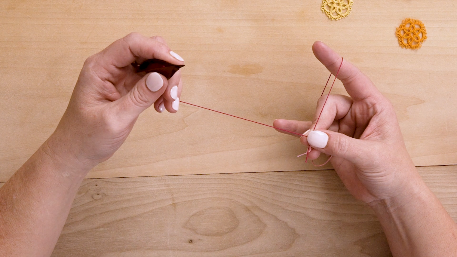 Left-handed instructions showing how to get started holding the thread and tatting.