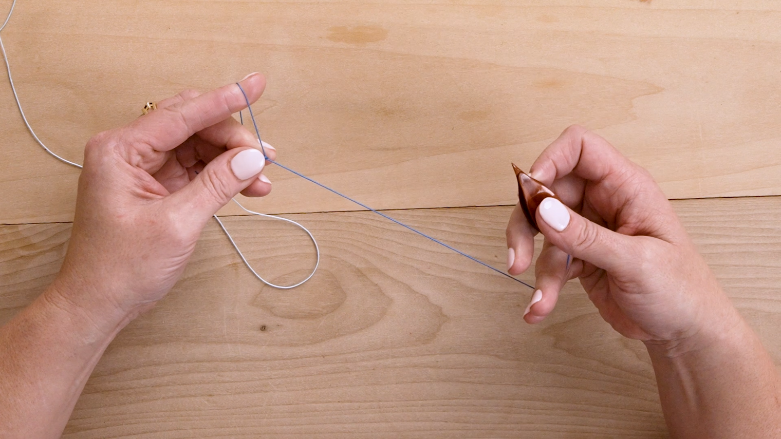 Right-handed instructions showing how to get started holding the thread and tatting.
