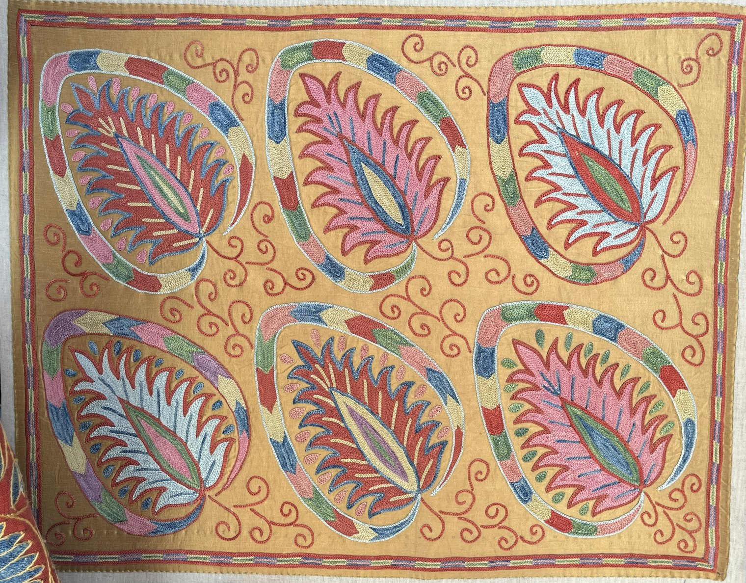 Silk embroidery from the Turkish embroidery collective Mehmet Cetinkaya Gallery on display at the International Folk Art Market.