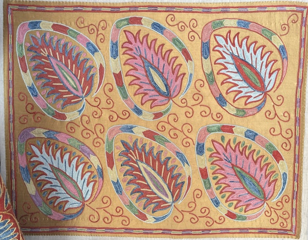 Silk embroidery from the Turkish embroidery collective Mehmet Cetinkaya Gallery on display at the International Folk Art Market.