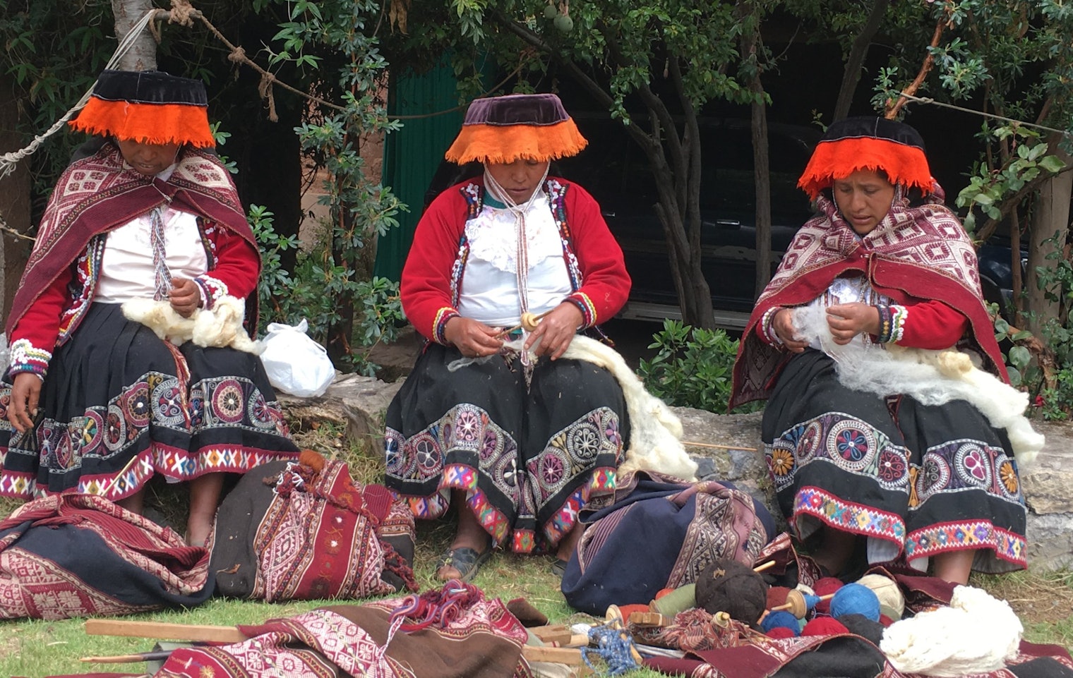 Artisans gather at the Center for Traditional Textiles of Cusco, Peru. They are easily recognized as being from the community of Chahuaytire by the embroidery on their skirts.