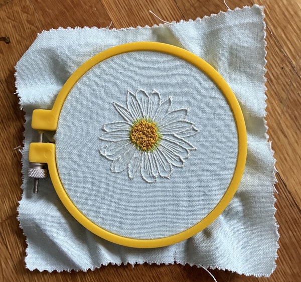 Fill the flower center with French knots.