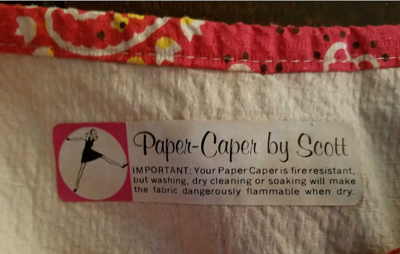 Dress label with a dire warning.