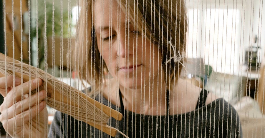 Sarah Neubert working at one of her looms