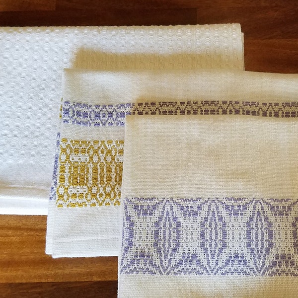 Shown from back: Huck ovals, Sweet and Lovely overshot bands, and Orange Peel overshot bands were the first towels from the warp.