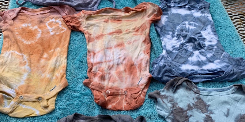 Mud and indigo dyed onesies