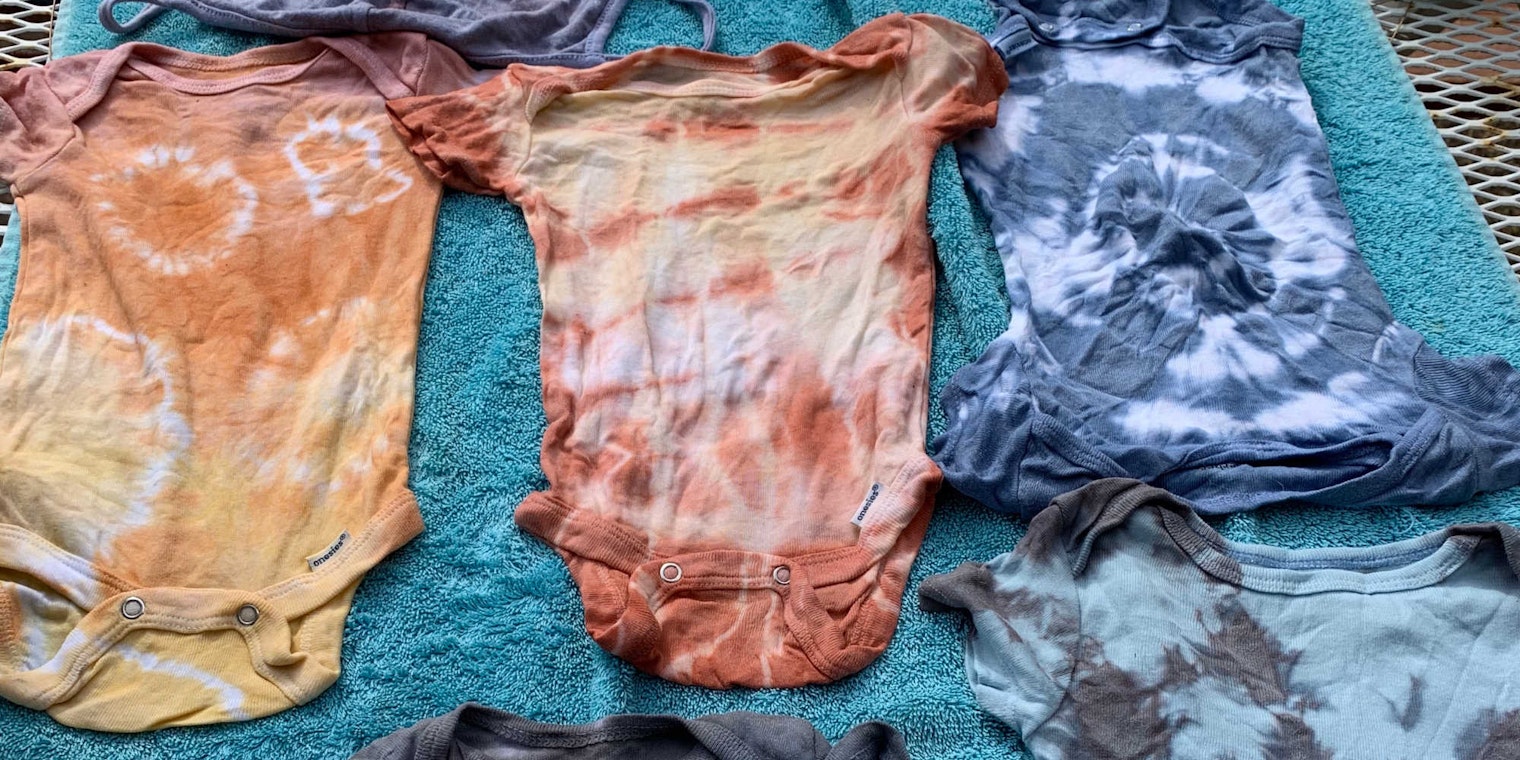 Mud and indigo dyed onesies
