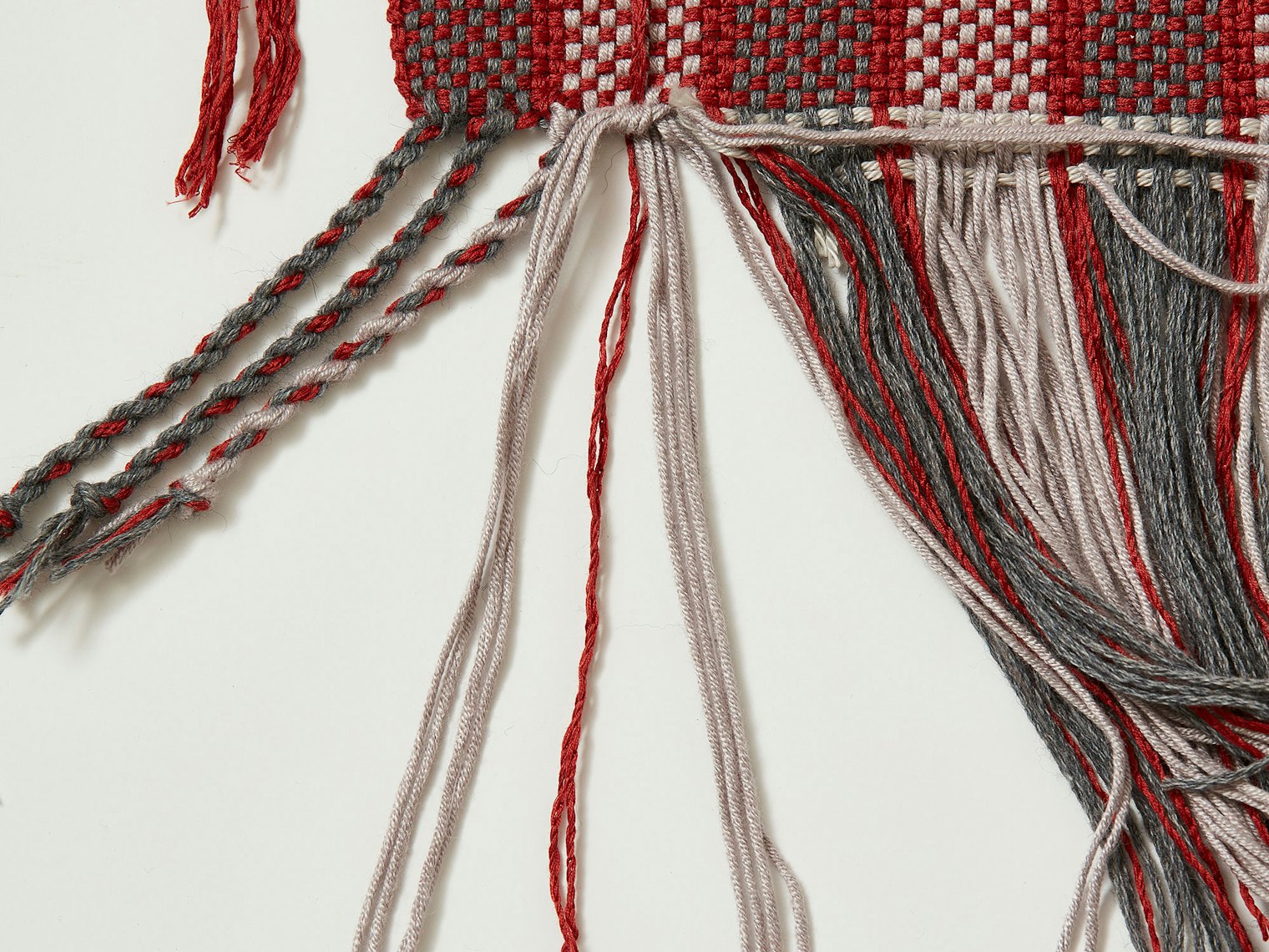 Tie added weft in with a knot at the edge. Photo credit: George Boe