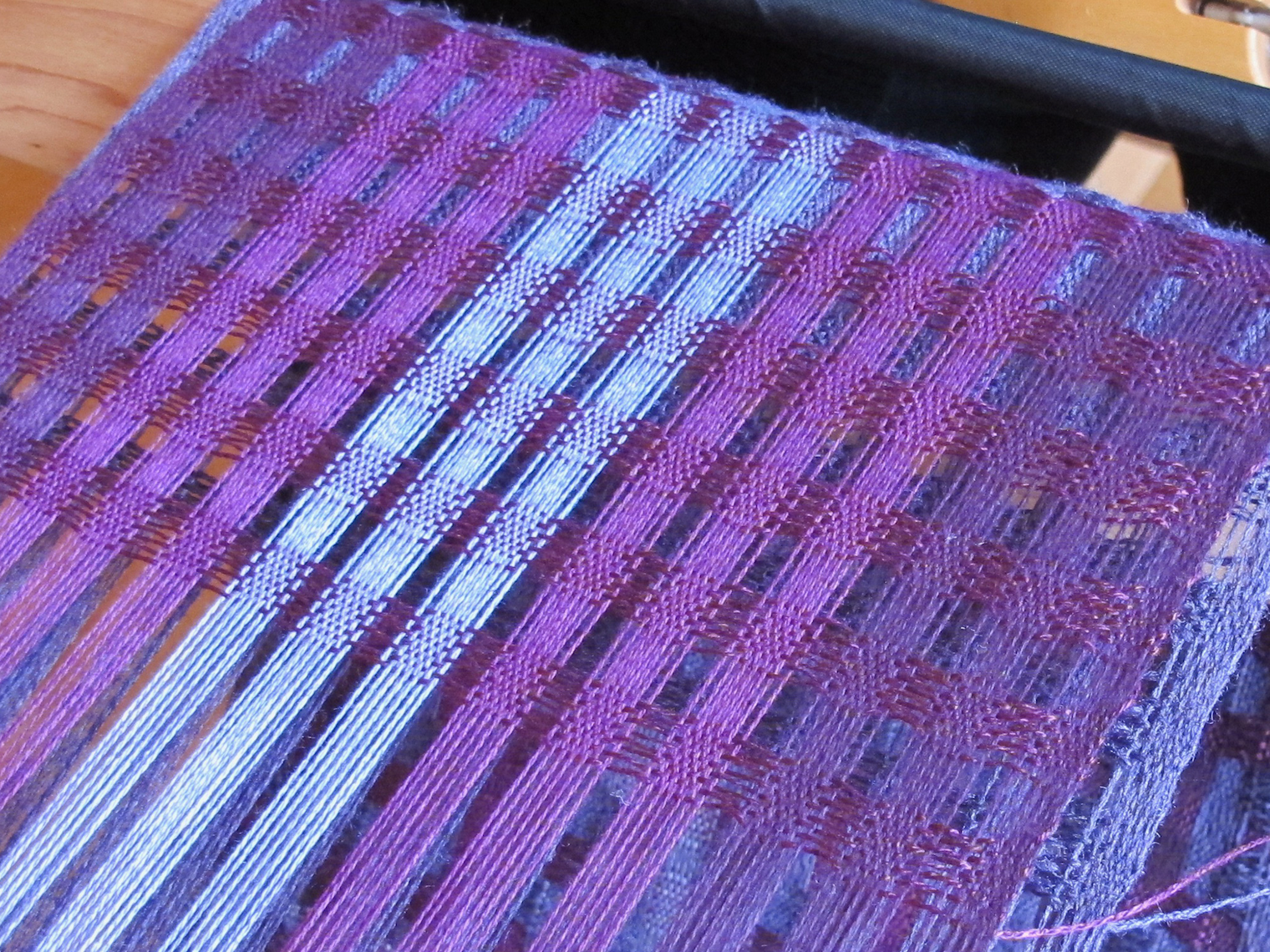 Winding warps with two layers can be tricky because the threads often co-mingle and cause havoc. Photos from New Dimensions in Deflected Doubleweave Video