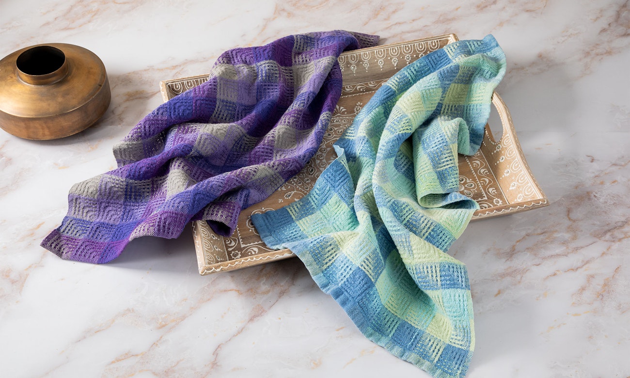 The original and new versions of My Very Peri Perfect Towels by Tracy Kaestner. Photo by Matt Graves