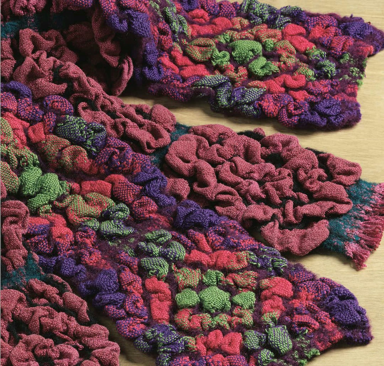 A deflected doubleweave scarf with differential shrinkage to create big texture