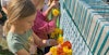 Weaving on a Flower-Filled Loom Image