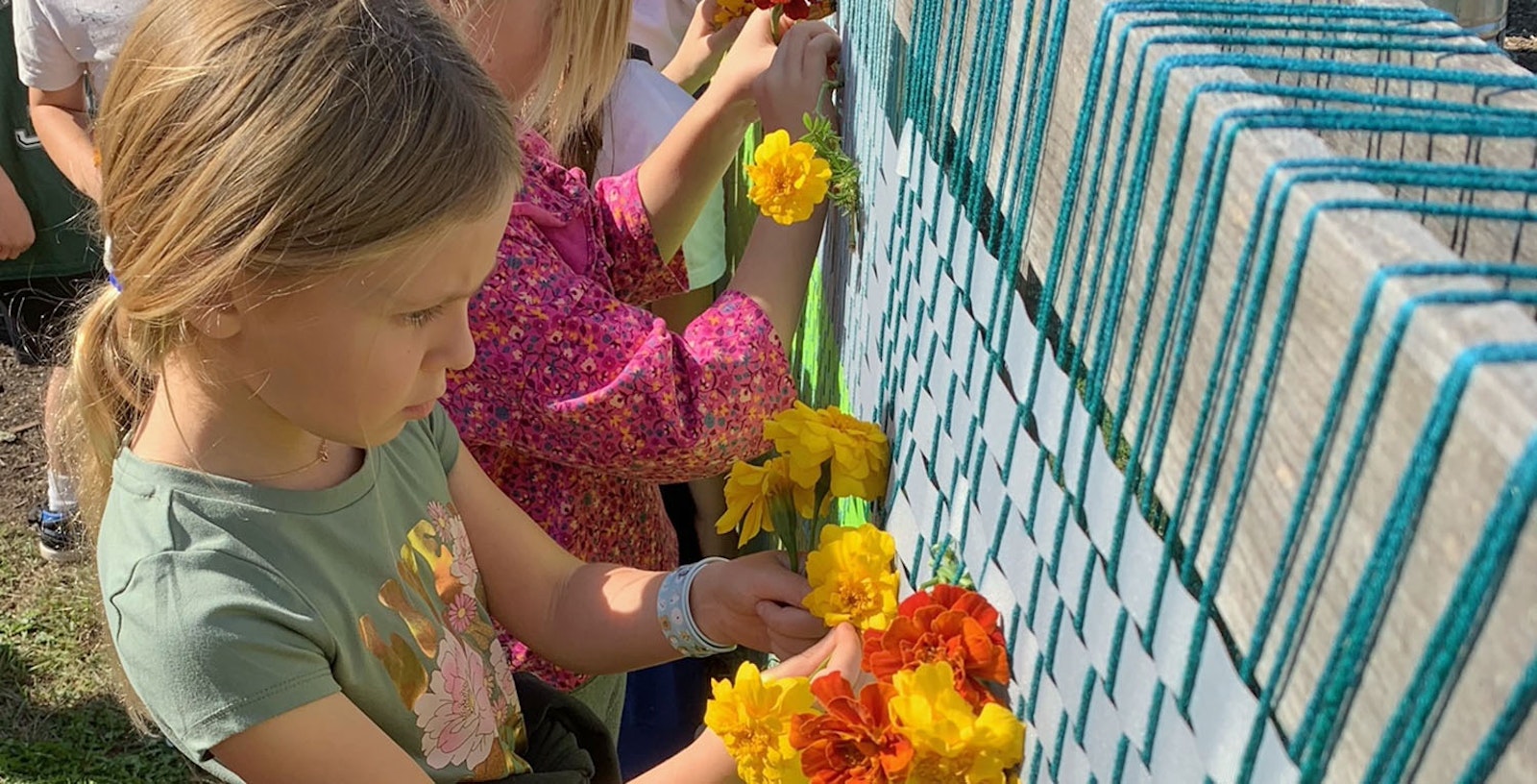 Weaving on a Flower-Filled Loom Primary Image