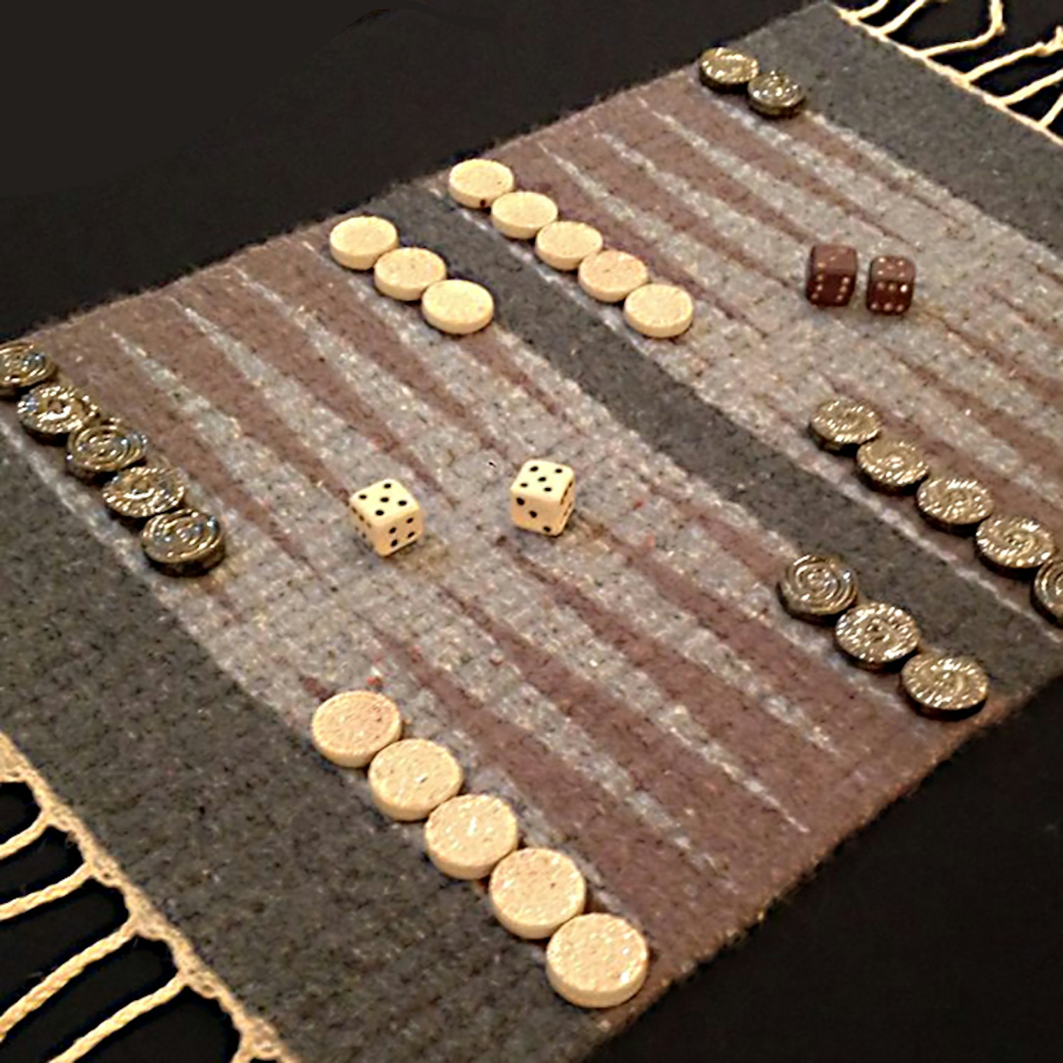 A backgammon board in modified 3-end block weave with shaft-switching, in collaboration with potter Rose Conway.