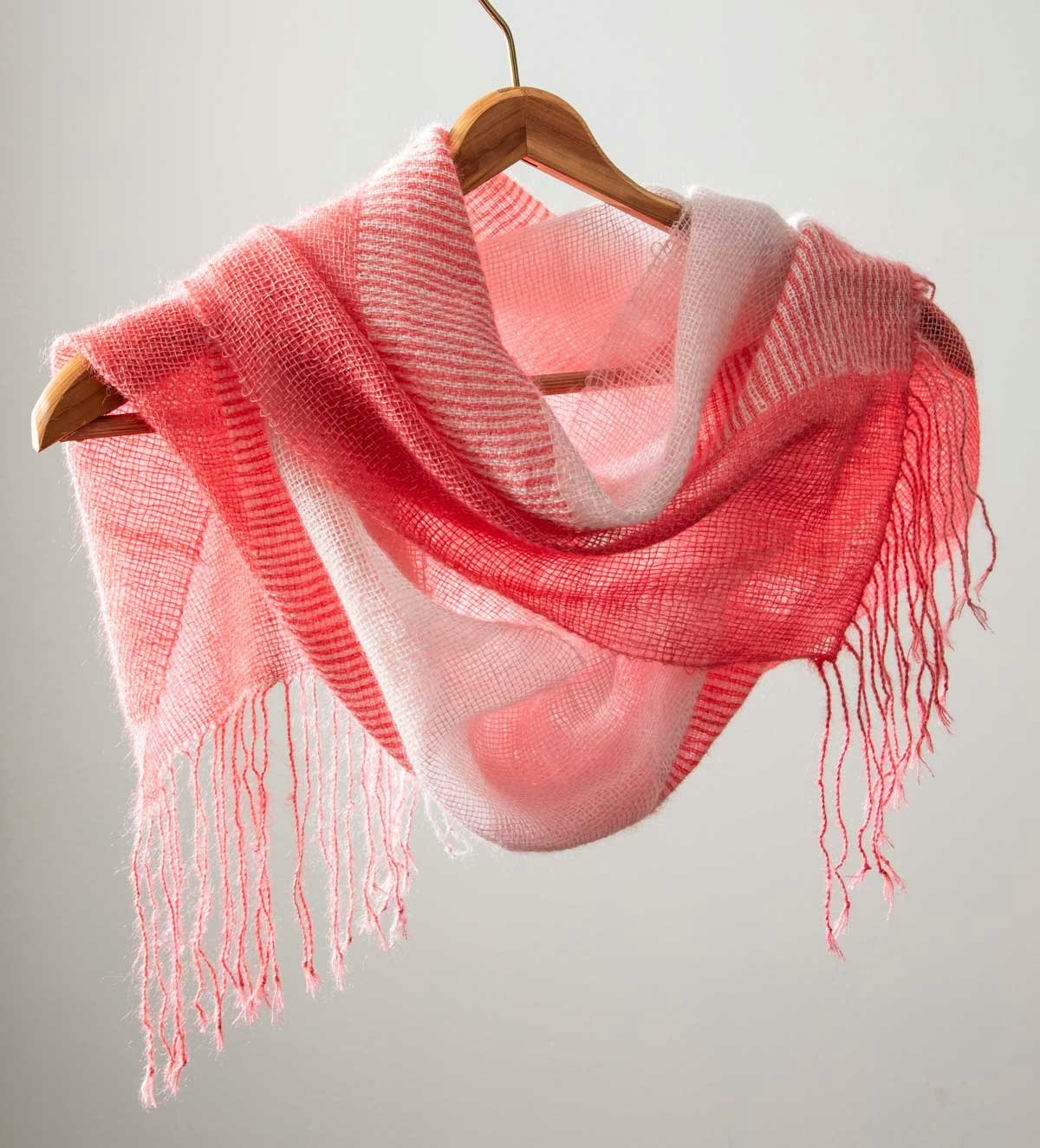 Yvonne Ellsworth’s Cherry Blossom Scarf, from the Spring 2025 issue, uses a doubleweave section in the middle, flanked by plain weave on the edges. Photo by Matt Graves