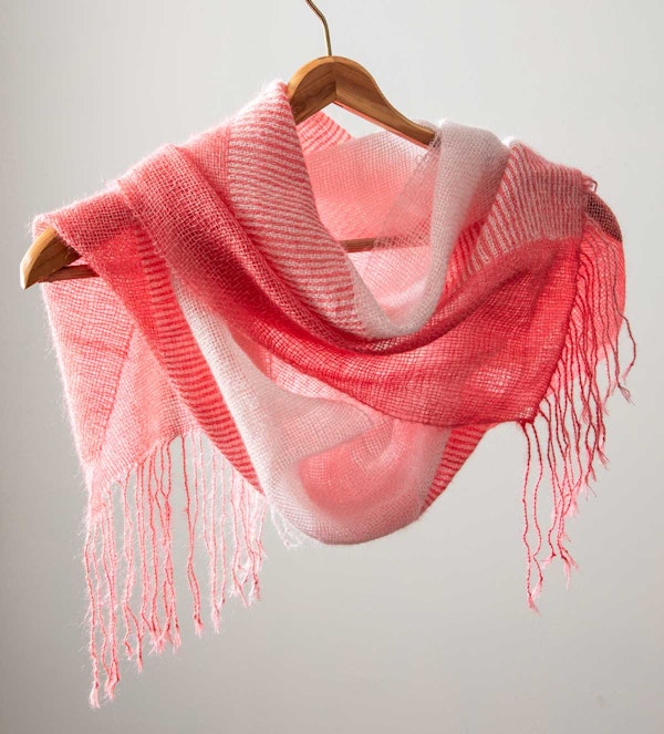 Yvonne Ellsworth’s Cherry Blossom Scarf, from the Spring 2025 issue, uses a doubleweave section in the middle, flanked by plain weave on the edges. Photo by Matt Graves
