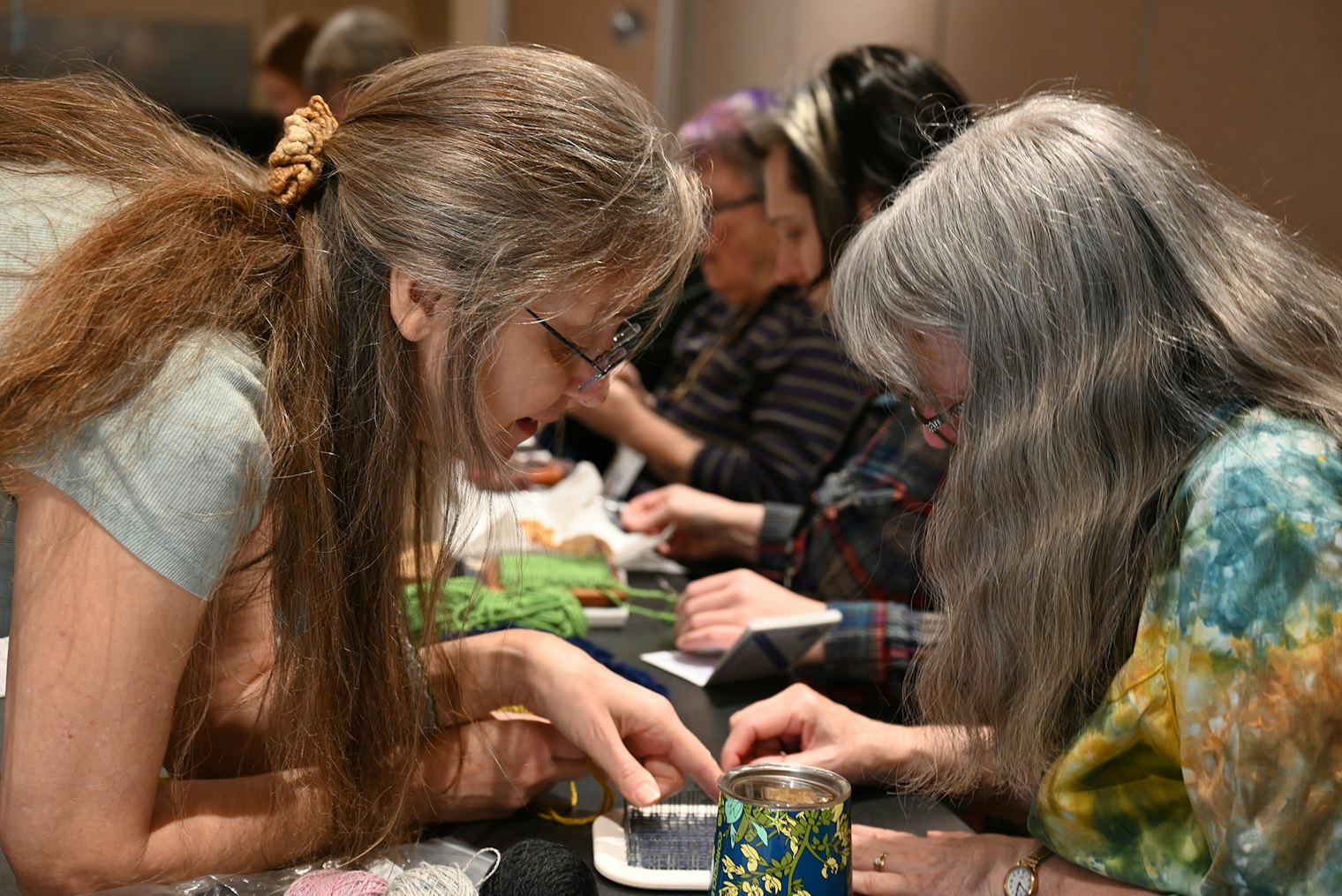 Angela K. Schneider, left, led a “Pin-Loom Party.”