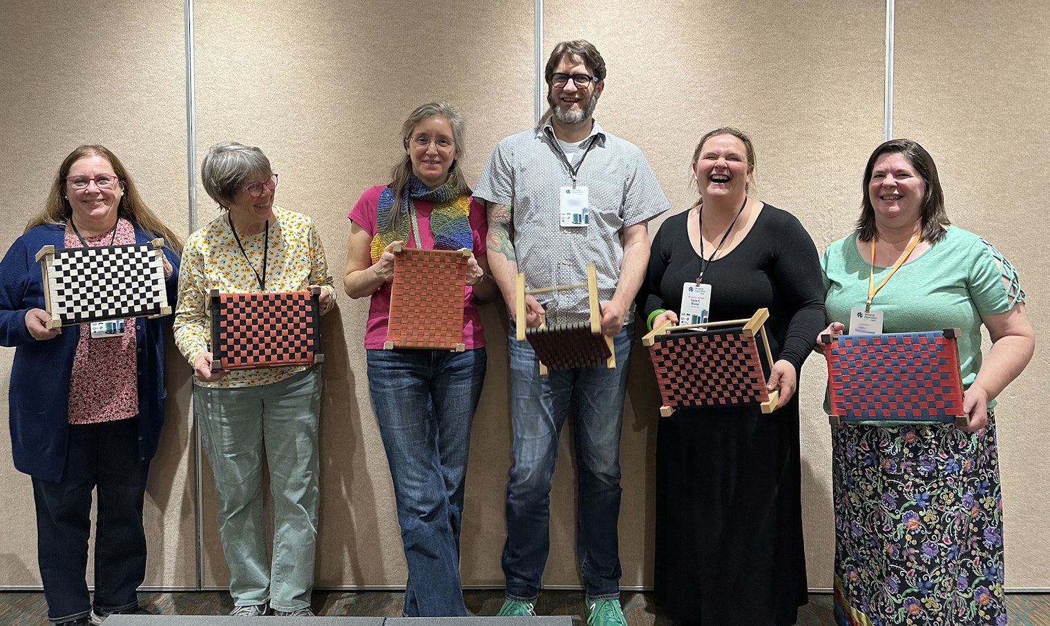 Students show off their finished work in Sara C. Bixler’s “Shaker Stool Weaving” class. Sara is standing second from right.