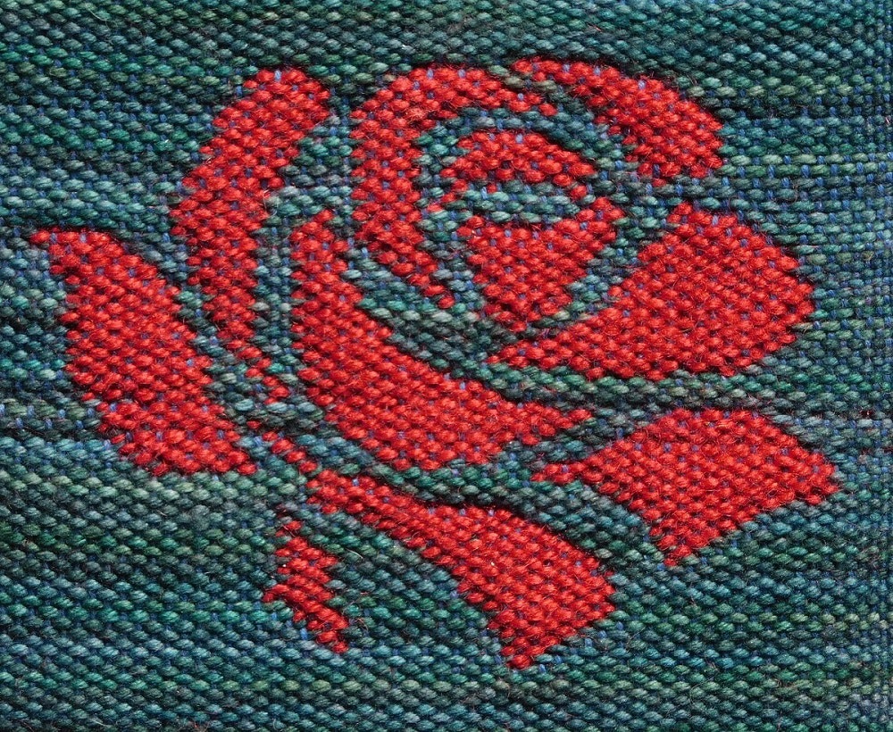 The front face of a rose woven in doubleweave.
