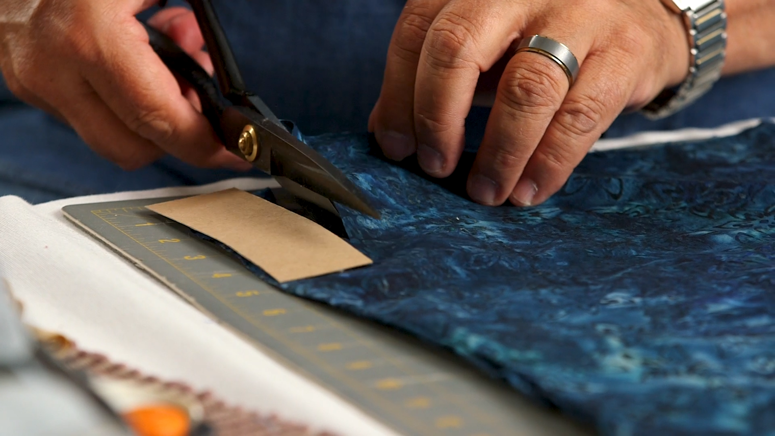 Use your template to make several 4-inch-long cuts along one end of your fabric. It will look like it’s roughly fringed.