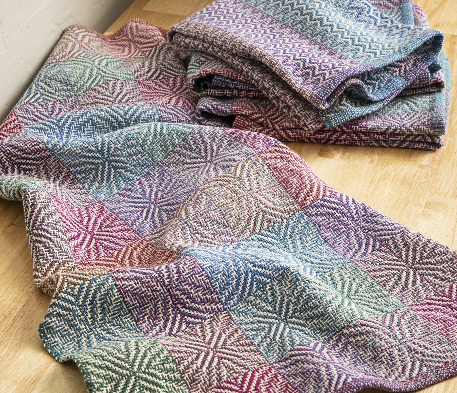 Dorothy Tuthill’s Shadow Play Dish Towels include treadling options for X’s, O’s, a mix of both, or zigzagging columns.