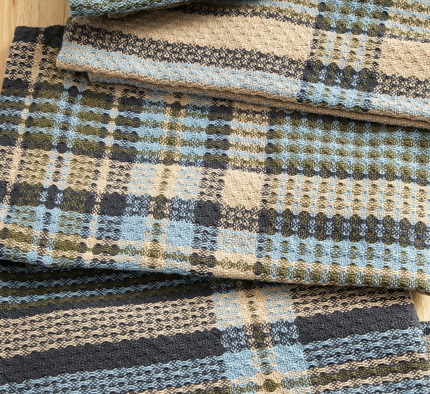 Rebecca Logan’s Stormy Skies Towels and coordinating wrap, from Fall 2025.