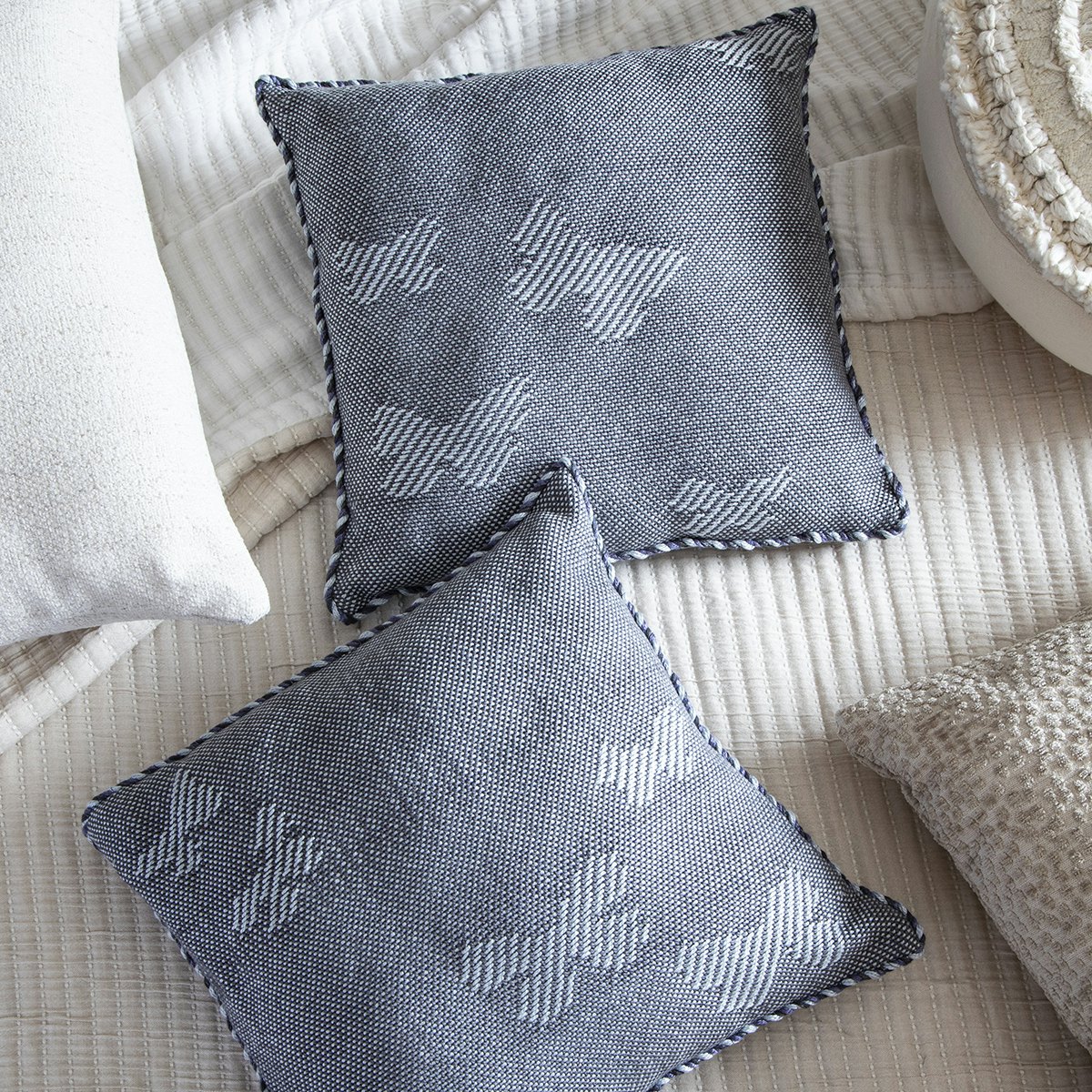 Penny Hajdu used a twill pick-up technique to portray a modest, and newly discovered, butterfly on a pair of pillow covers.