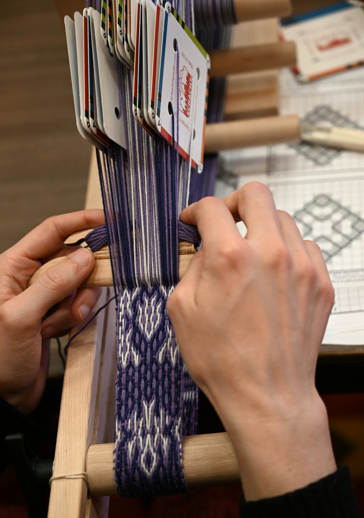 A Sulawesi-style tablet-woven band under construction at Weave Together 2026.