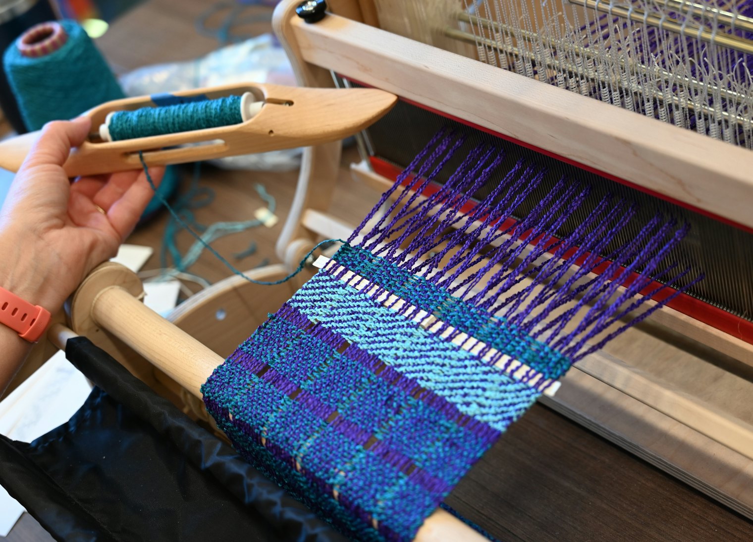 Weaving a scarf in a day at Weave Together 2026.