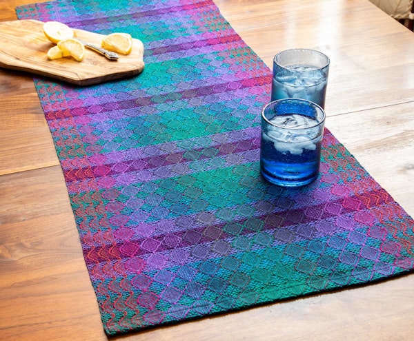 Sheila O’Hara’s Gemstone Table Runner, from the Summer 2026 issue, uses doubled ends for gradual color blending. Photo by Matt Graves