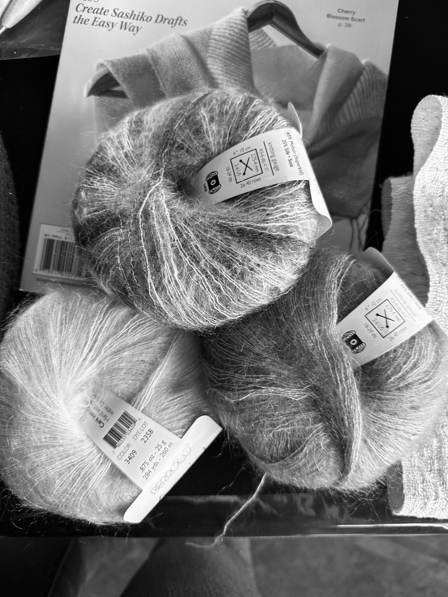 Here, those same yarns are shown in black and white, and we can see the light, medium, and dark values coming through.
