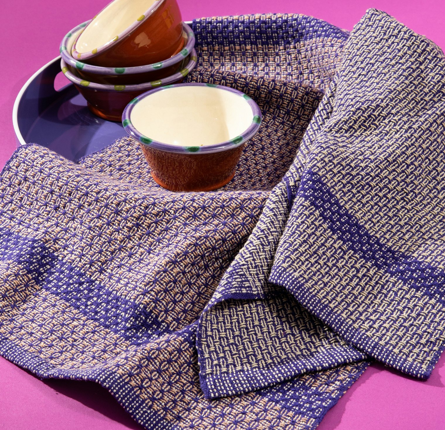 Rebecca Morris’s Subtle Shift Towels are woven in huck lace with color-and-weave.