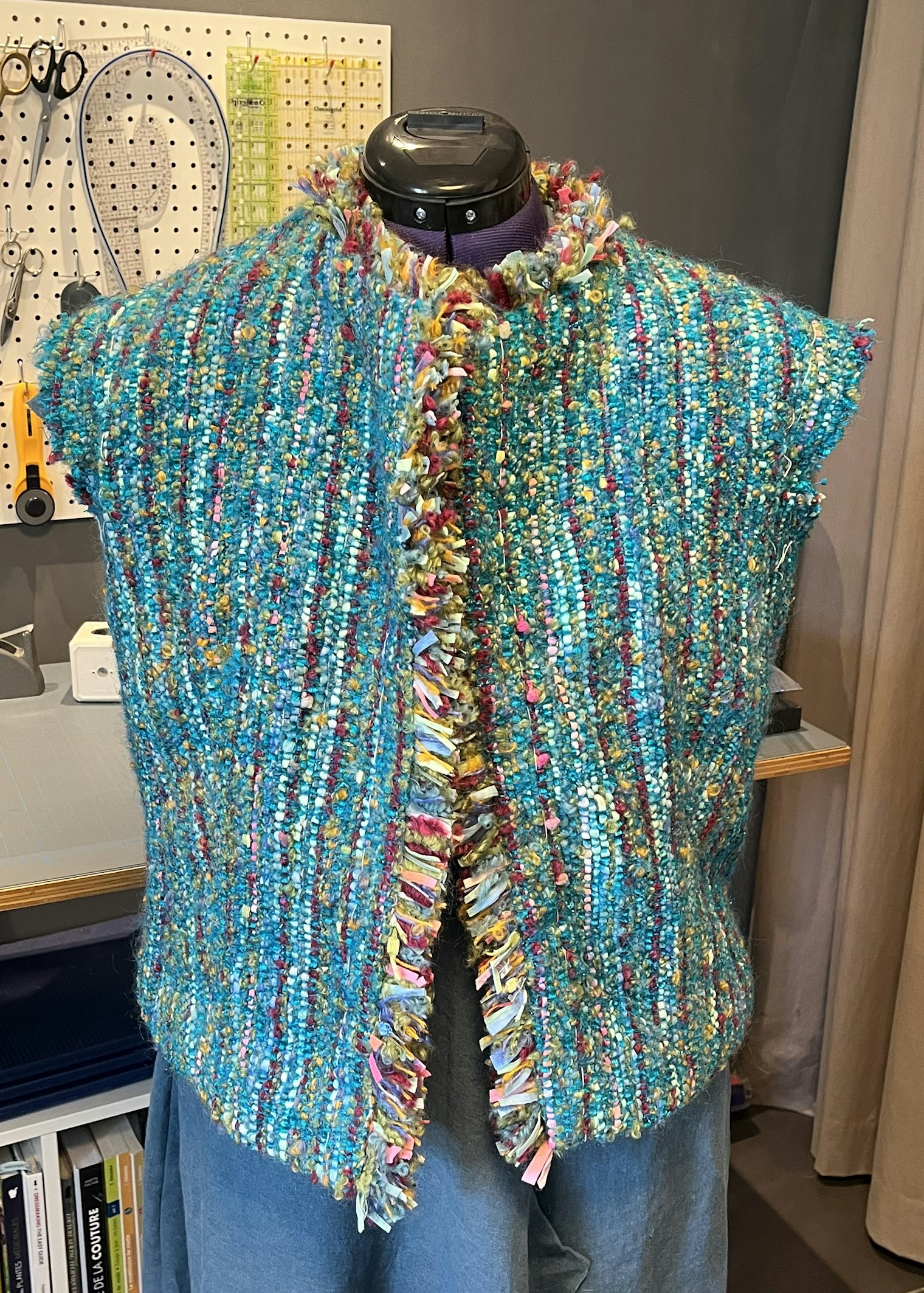 Barbara made more thrums fringe to apply around the neck and front openings of her jacket. Next, she’ll sew in the sleeves—and make a pockets decision.
