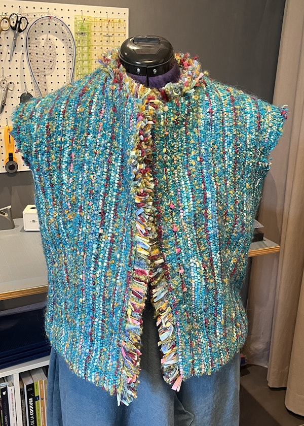 Barbara made more thrums fringe to apply around the neck and front openings of her jacket. Next, she’ll sew in the sleeves—and make a pockets decision.