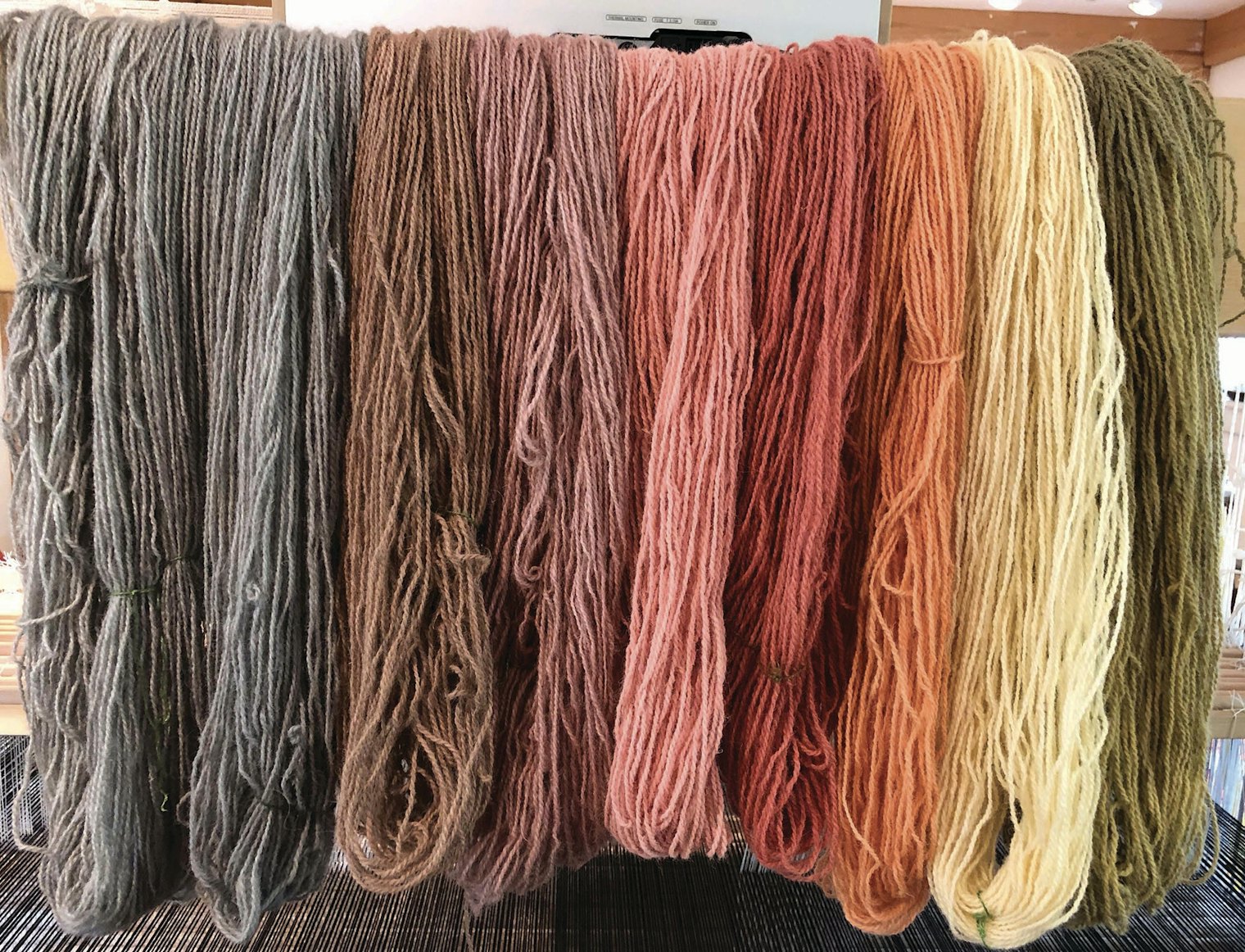 The fully dried mud-dyed skeins.