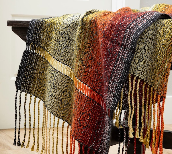 Two lines of hemstitching provide a dramatic effect in Samantha Haring’s Monarch Scarf.