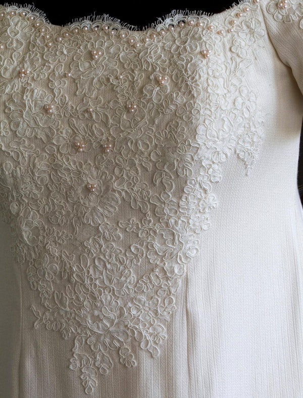 A close-up of the wedding dress.